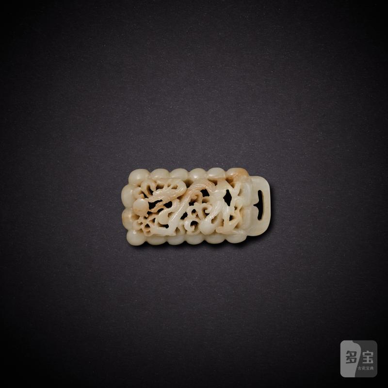 A white jade reticulated ‘dragon’ belt plaque, Yuan dynasty | 元 白玉鏤雕龍紋帶扣
